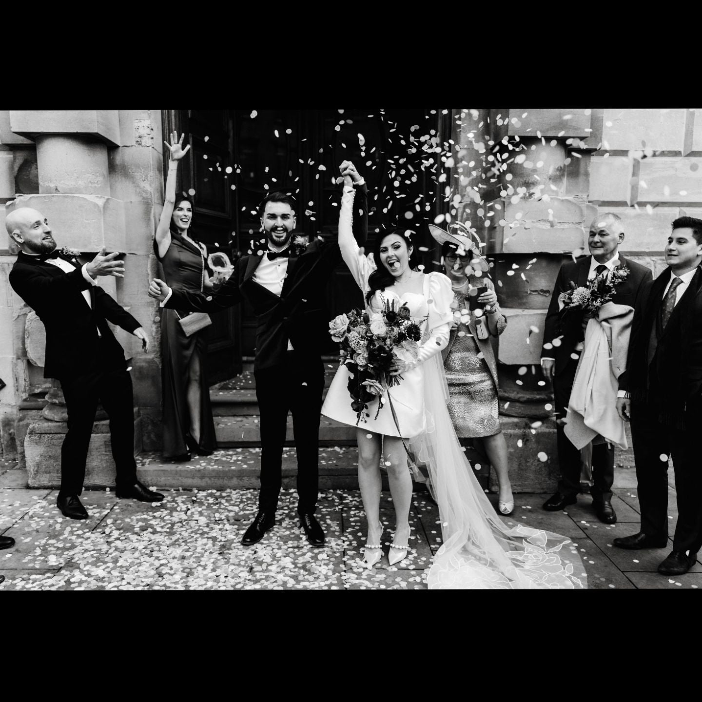 A black and white photo of a bride and groom