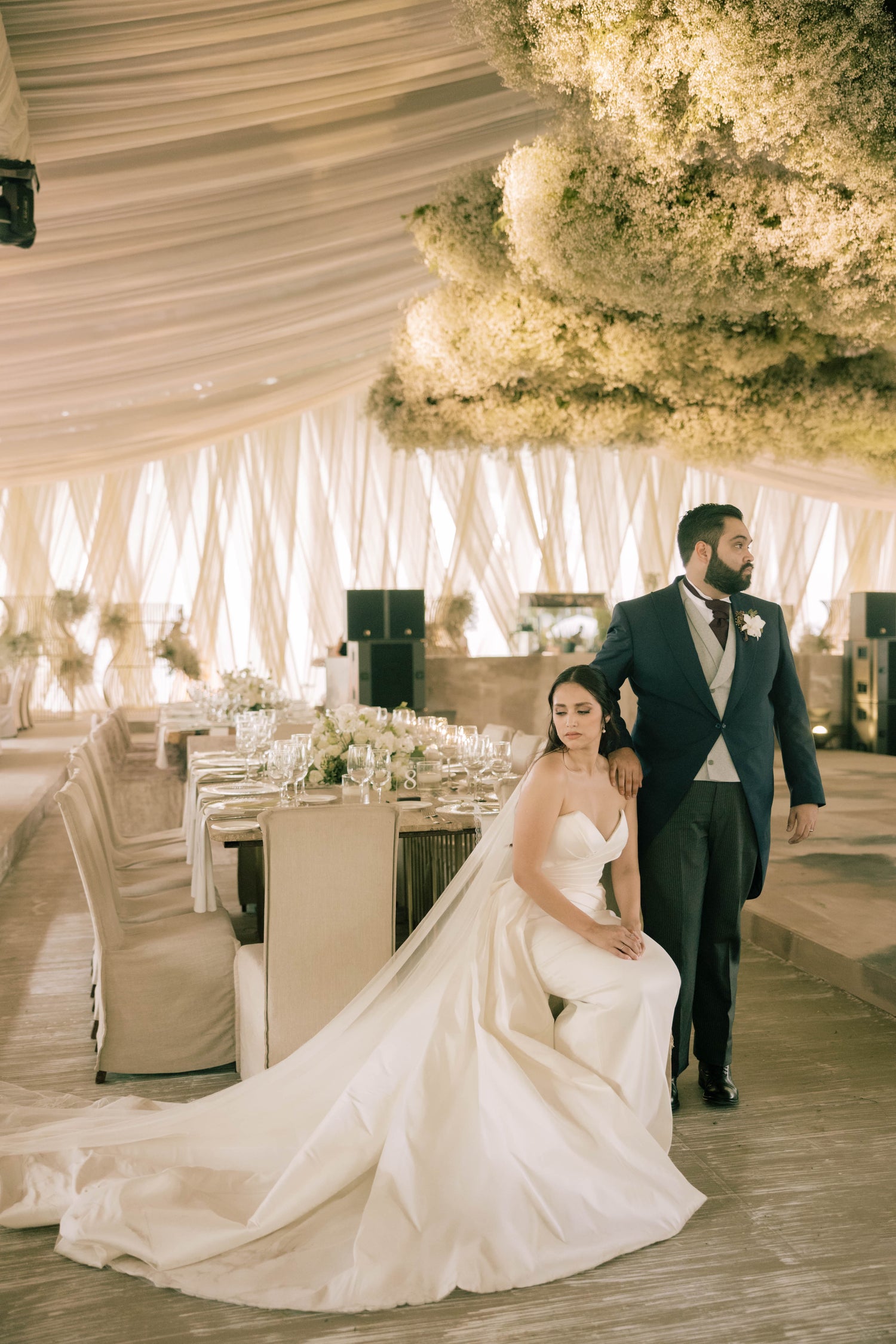 A bride and groom posing for a picture