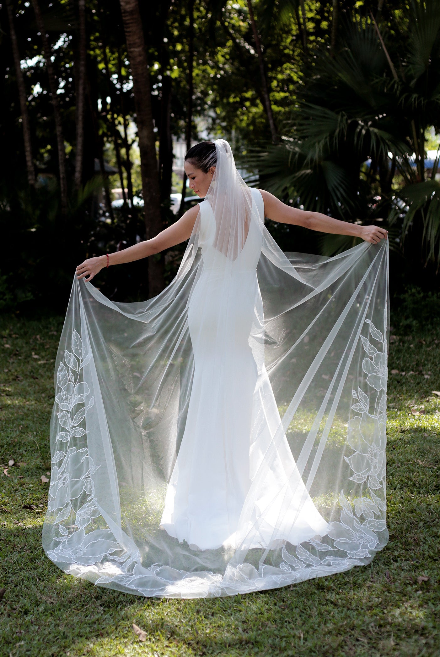 Stunning cathedral organza wedding veil, the SOPHIA style, featuring intricate floral lace and a flowing, graceful train.

