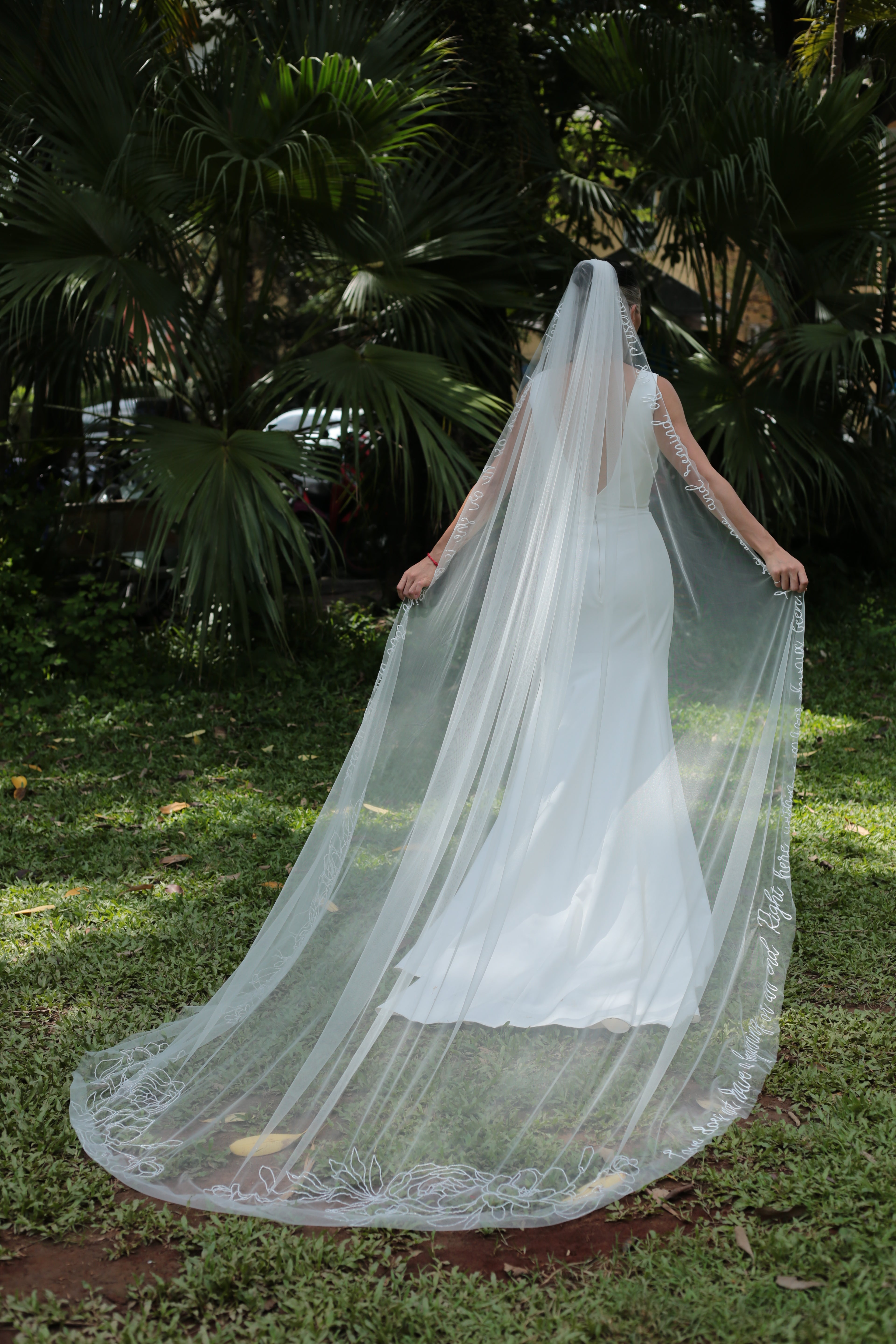 a shot from behind of KRISTEN | Beaded floral wedding veil