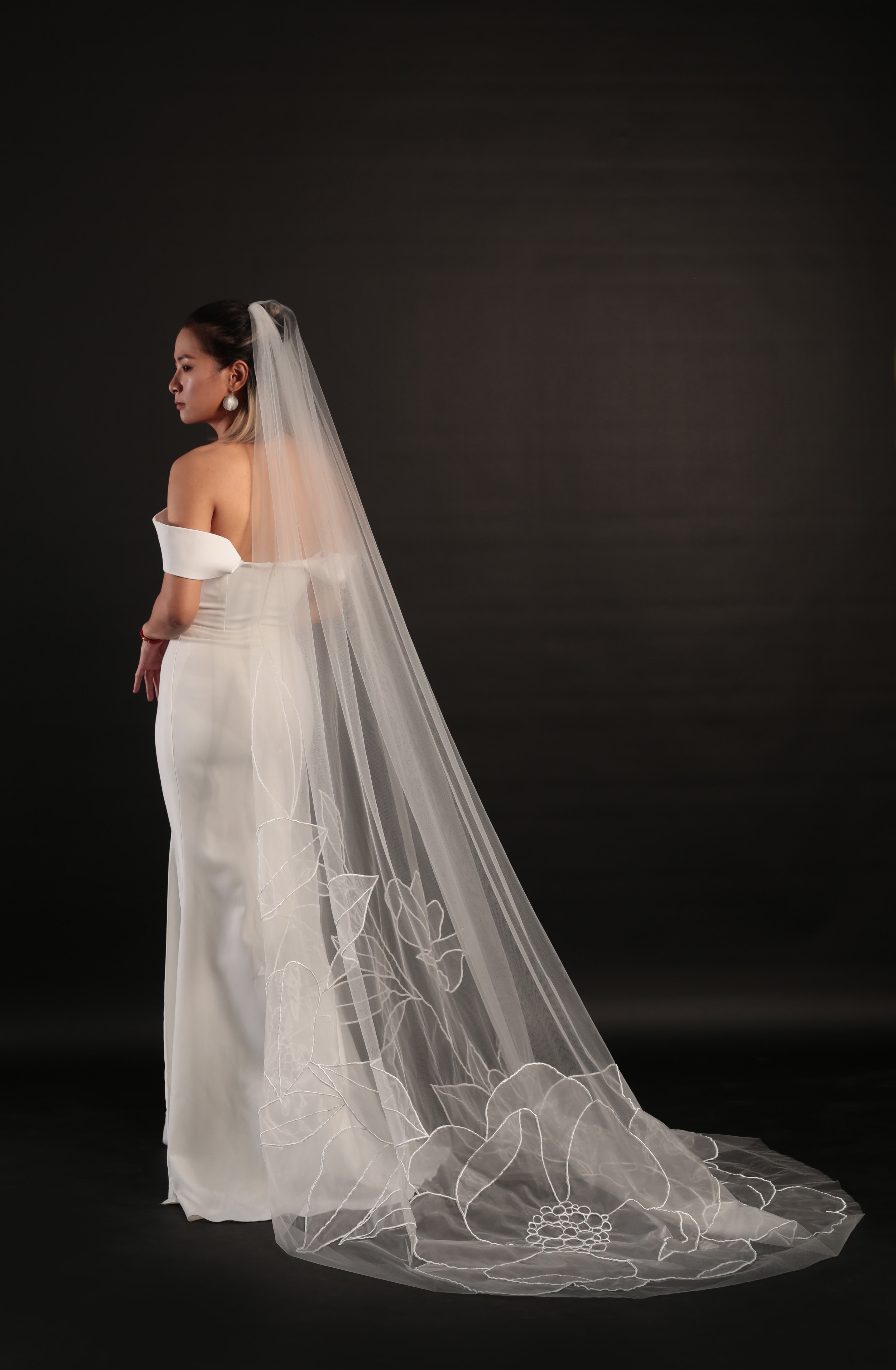 Side profile of bride with Lilly organza floral veil
