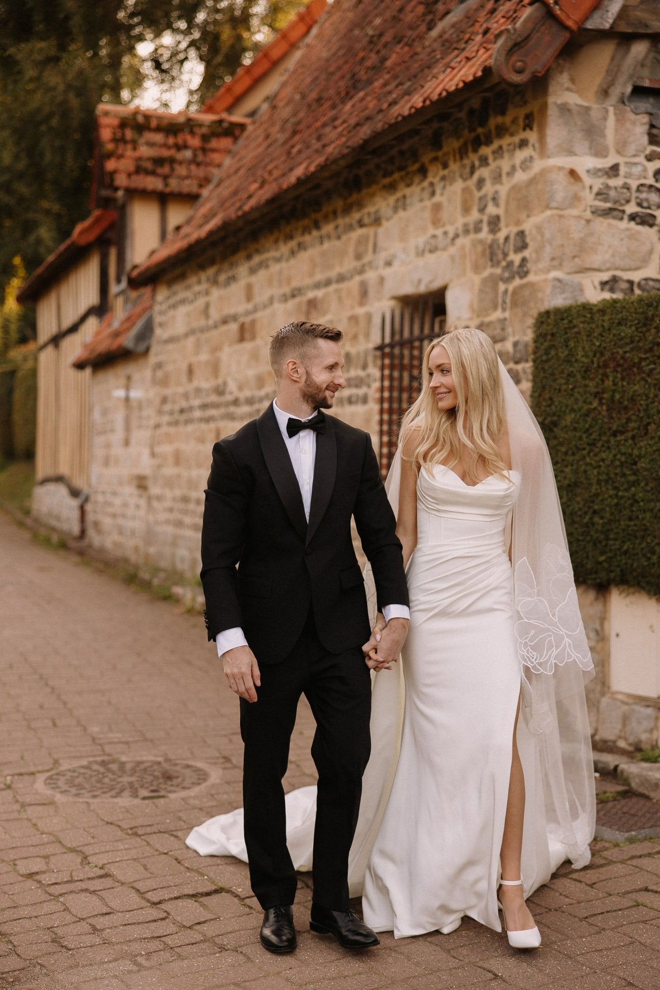 couple wearing wedding veil