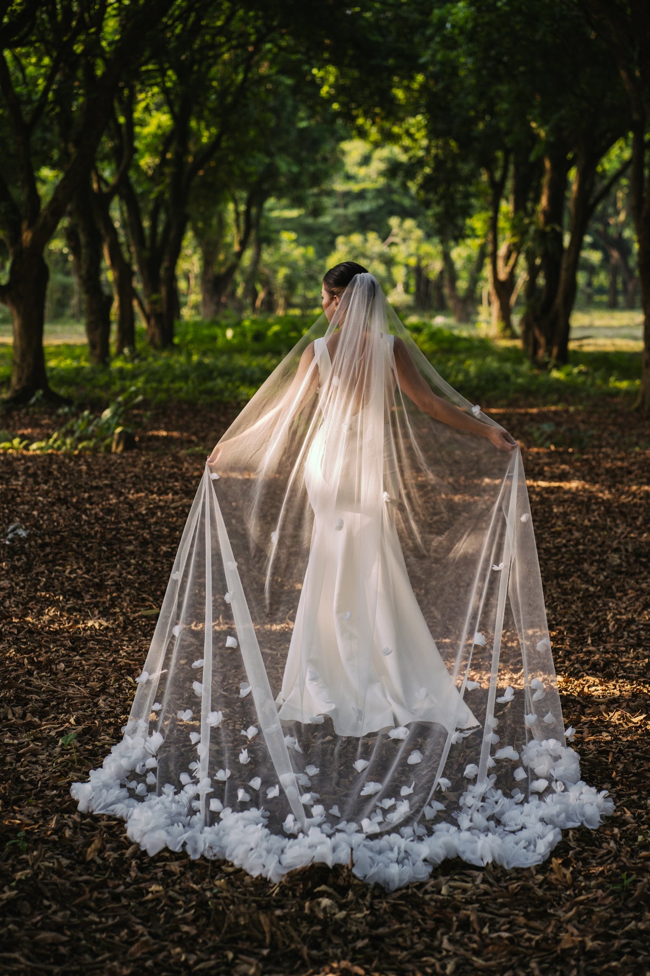 Bella 3D floral wedding veil, ivory tulle, clump of flower petals design, cascading to a scallop-shaped train.