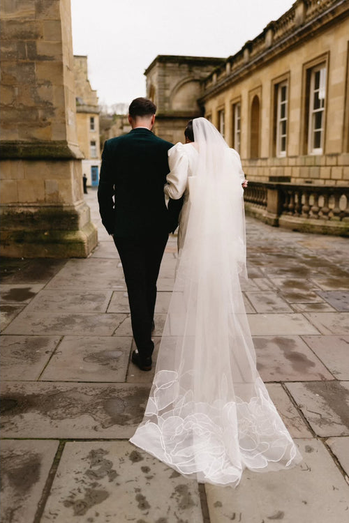 Bride and her floral rose chapel length wedding veil