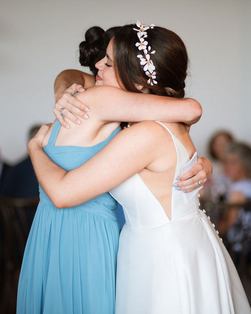 Bride with floral crown headpiece in a traditional church wedding
