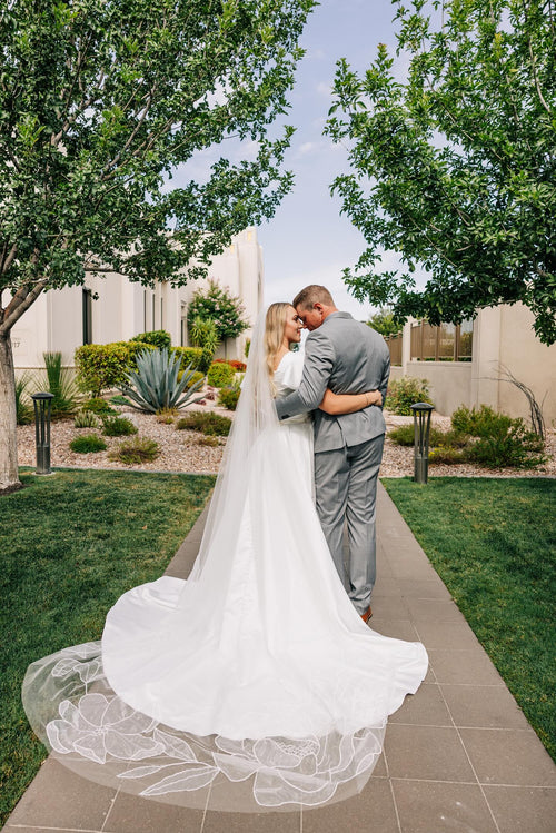 Bride Kiera Jarvis wearing Kaitie floral veil chapel-length