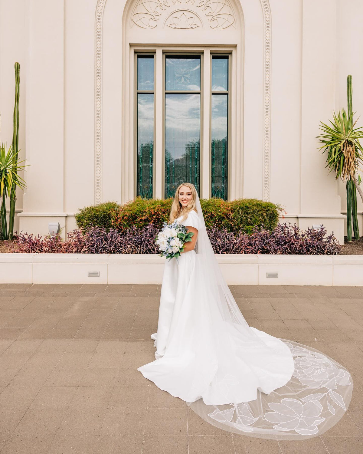 Bride Kiera Jarvis wearing Kaitie floral veil chapel-length