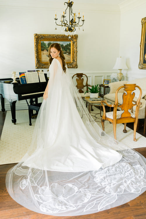 Bride Madeline Ringwald floral cape Kaitie veil
