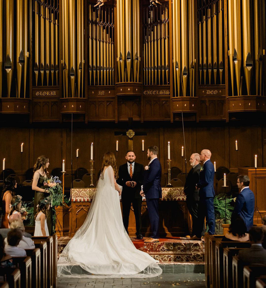 Bride Madeline Ringwald floral cape Kaitie veil in church