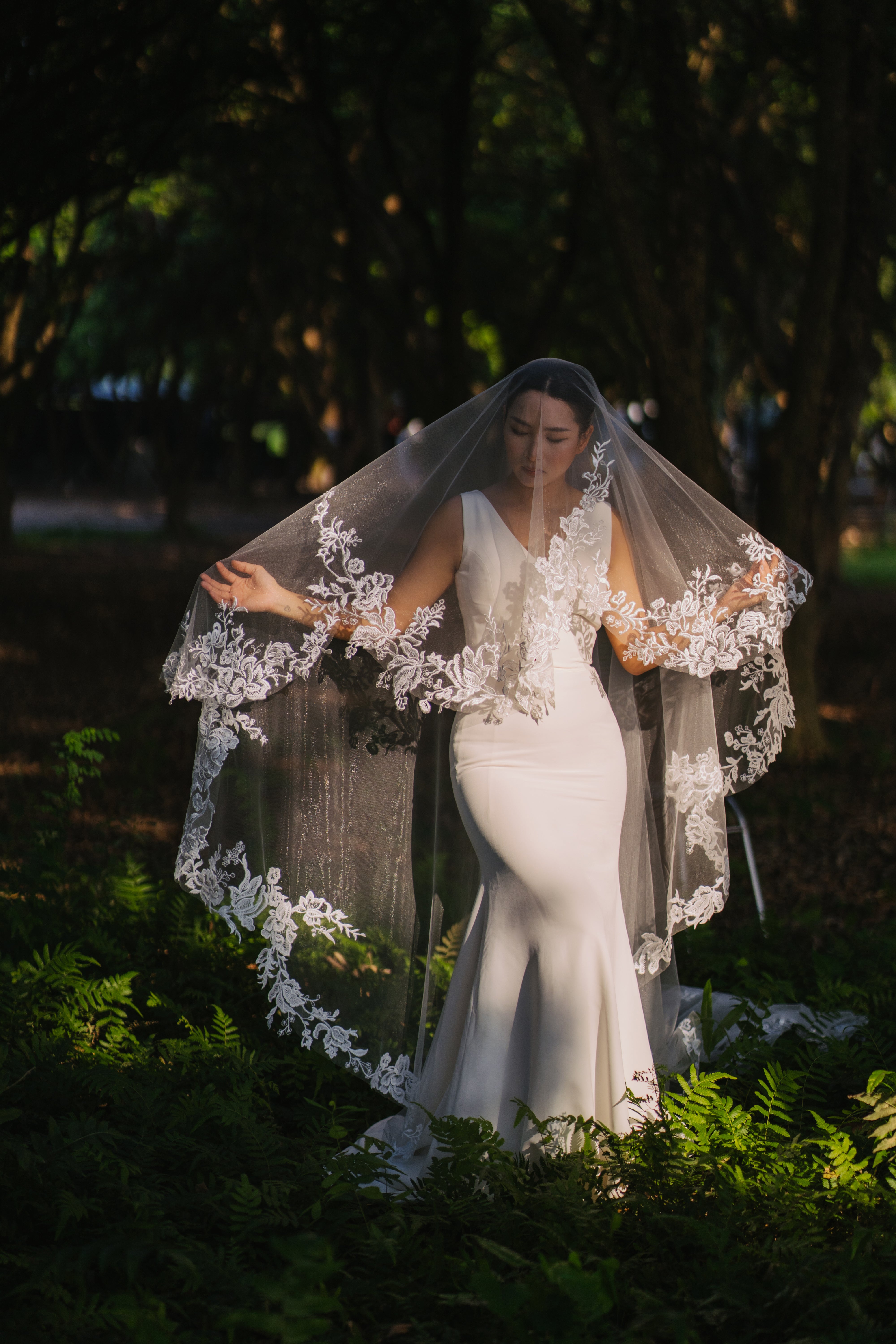 ELA lace embroidery cathedral scallop-shaped wedding veil, bride walking in a sunny rain forest