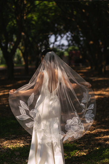 Kaitie fingertip length wedding veil with embroidered peony and cosmos flowers, tulle and organza fabric