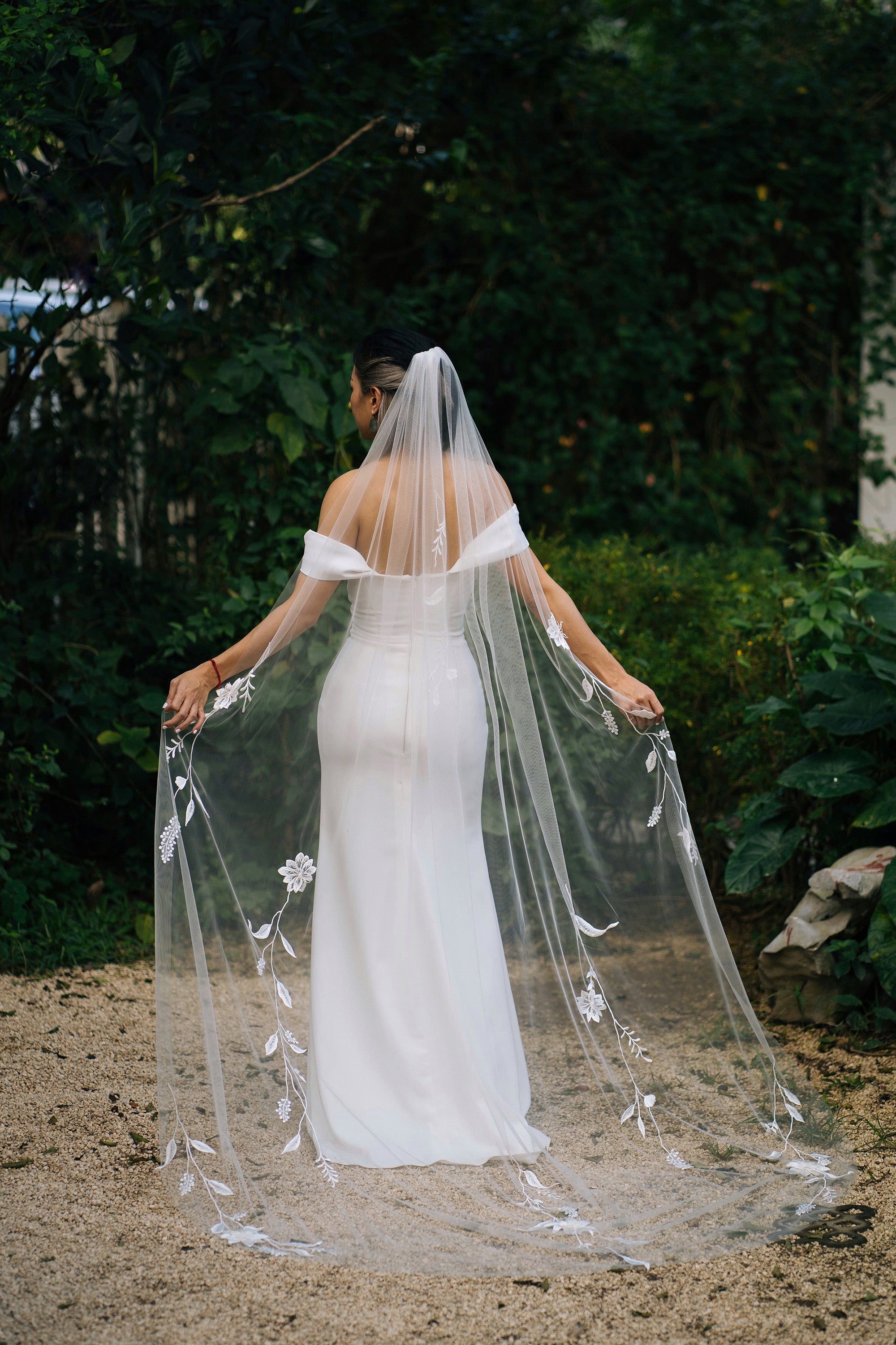 a bride wearing HANNAH | Embroidered wedding veil shot from behind