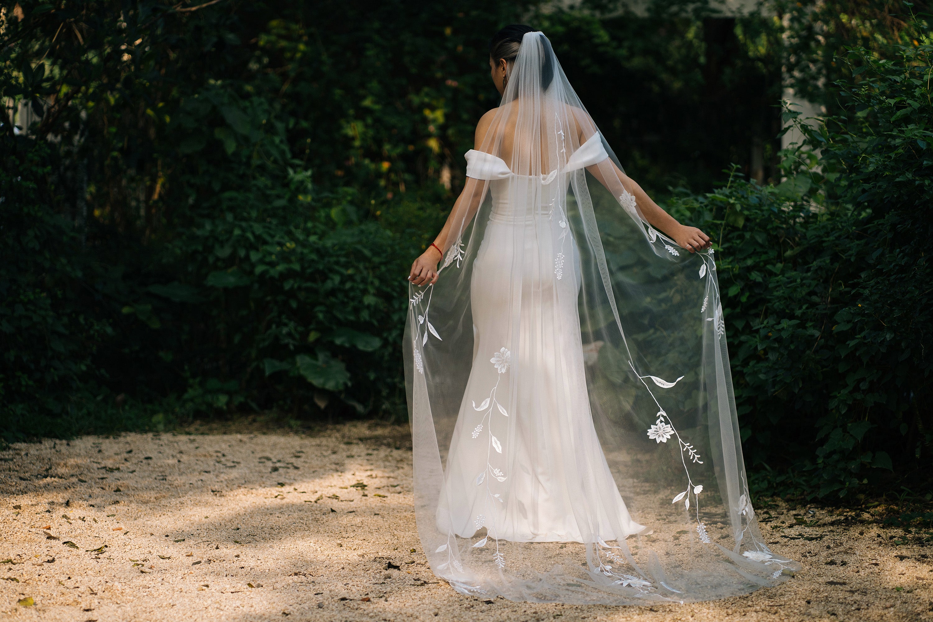 cinematic shot of a bride wearing HANNAH | Embroidered wedding veil