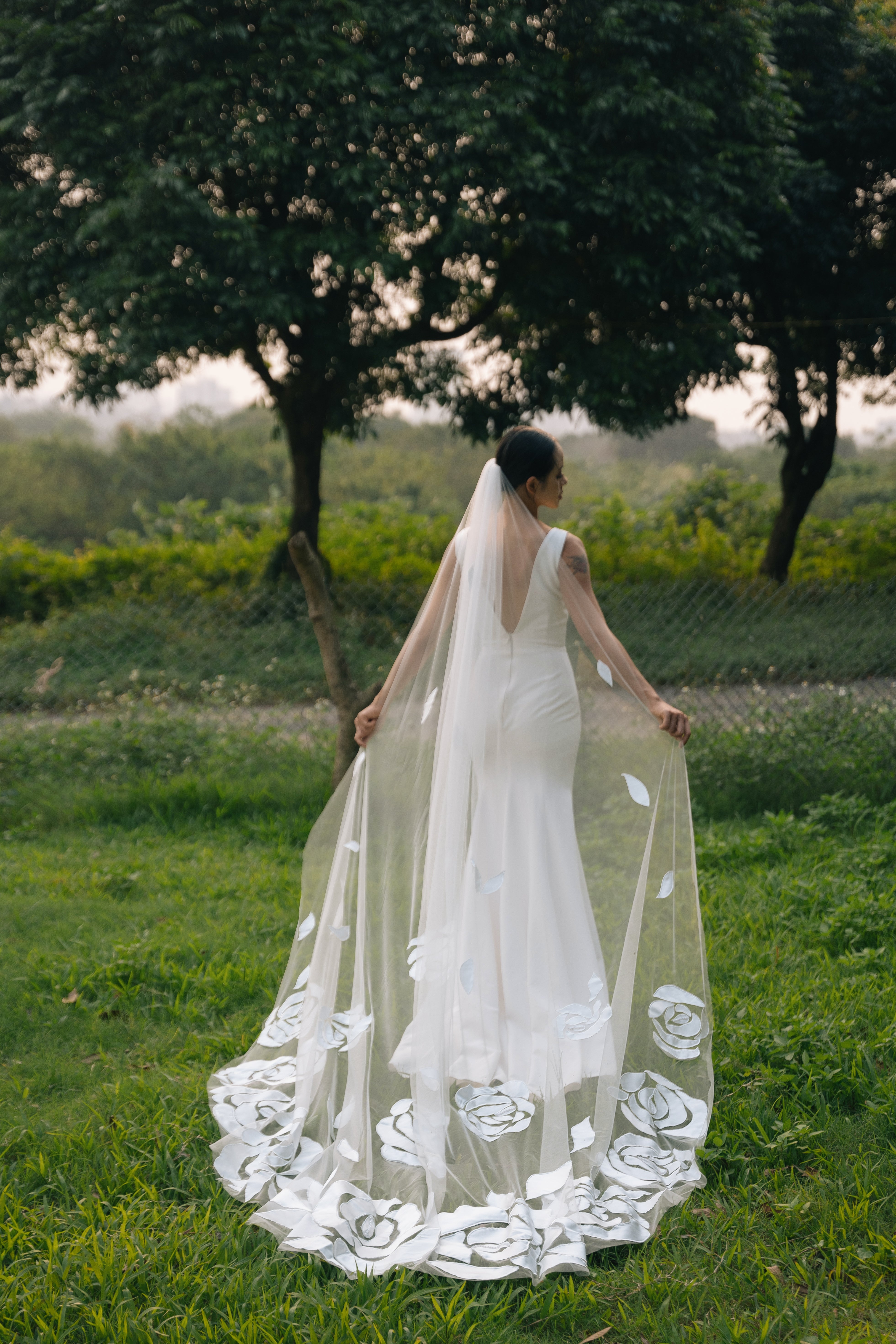 a shot from behind of bride wearing OSCAR | Cathedral 3D floral veil