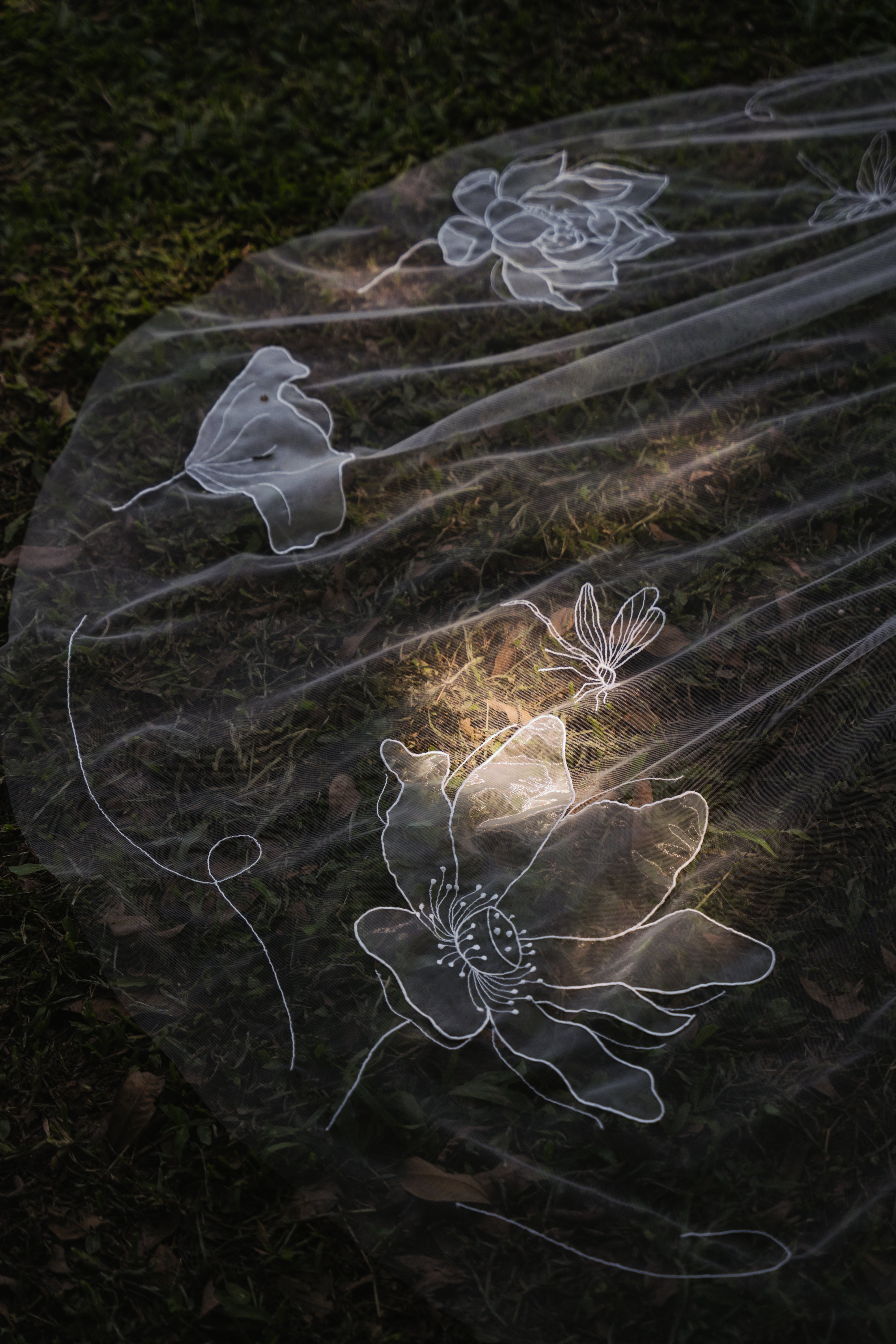 ground shot of beautiful design of SEN | Lotus organza embroidered wedding veil