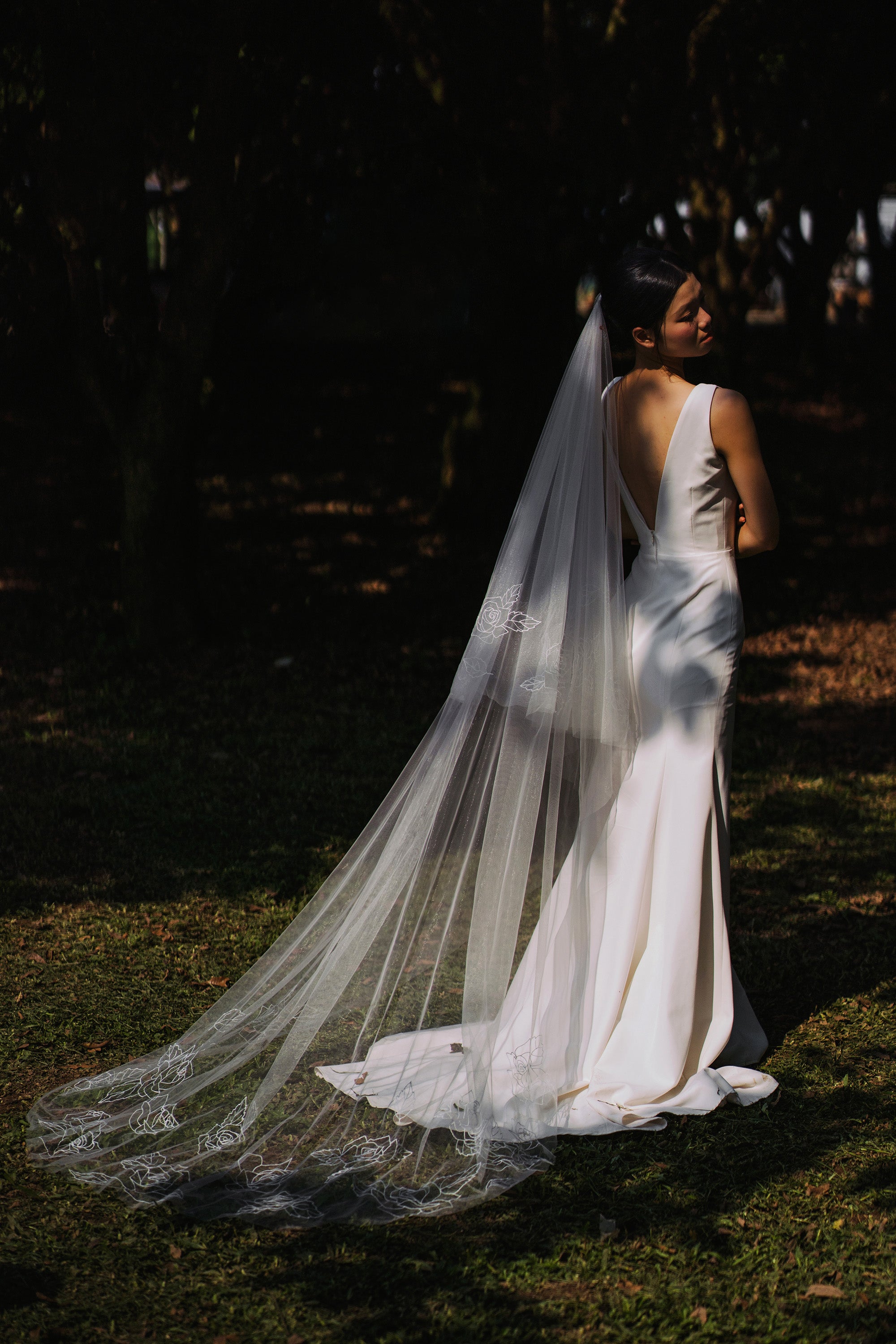 The sweeping train of the CHLOE veil, with a beautiful pattern of embroidered roses along the hem.

