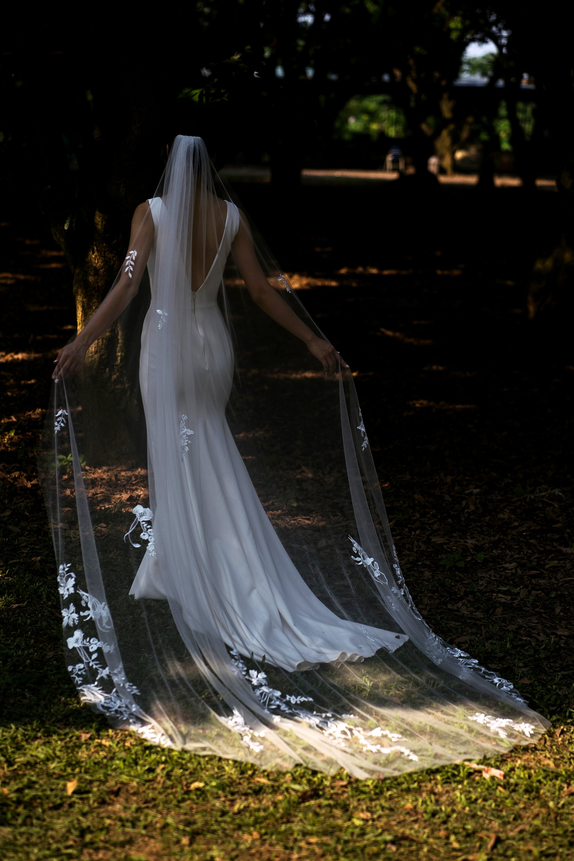 full shot from behind, a bride wearing KAROLINE | Floral lace wedding veil
