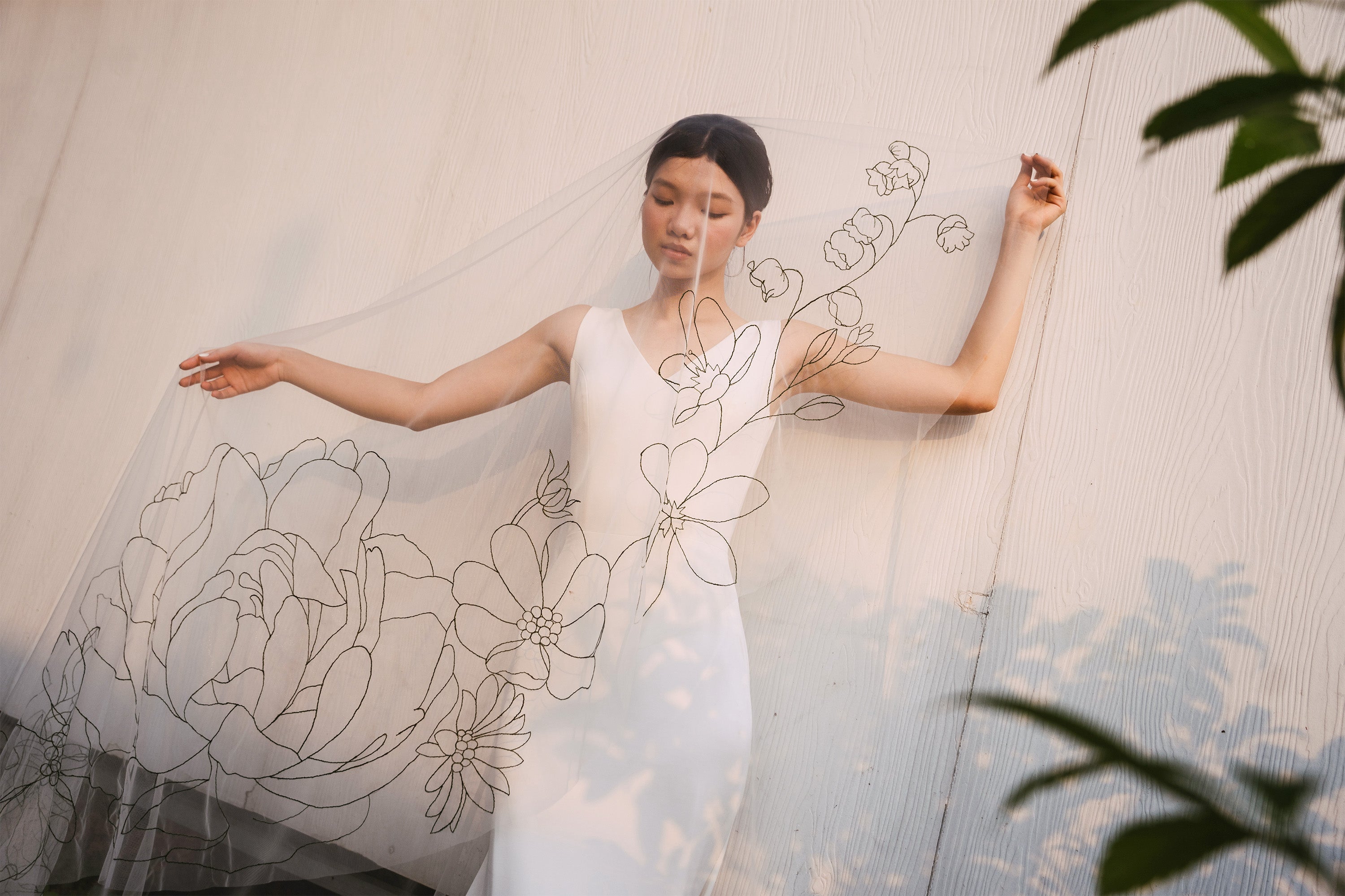 model wearing EMMA Veil | Dark green line floral embroidered veil