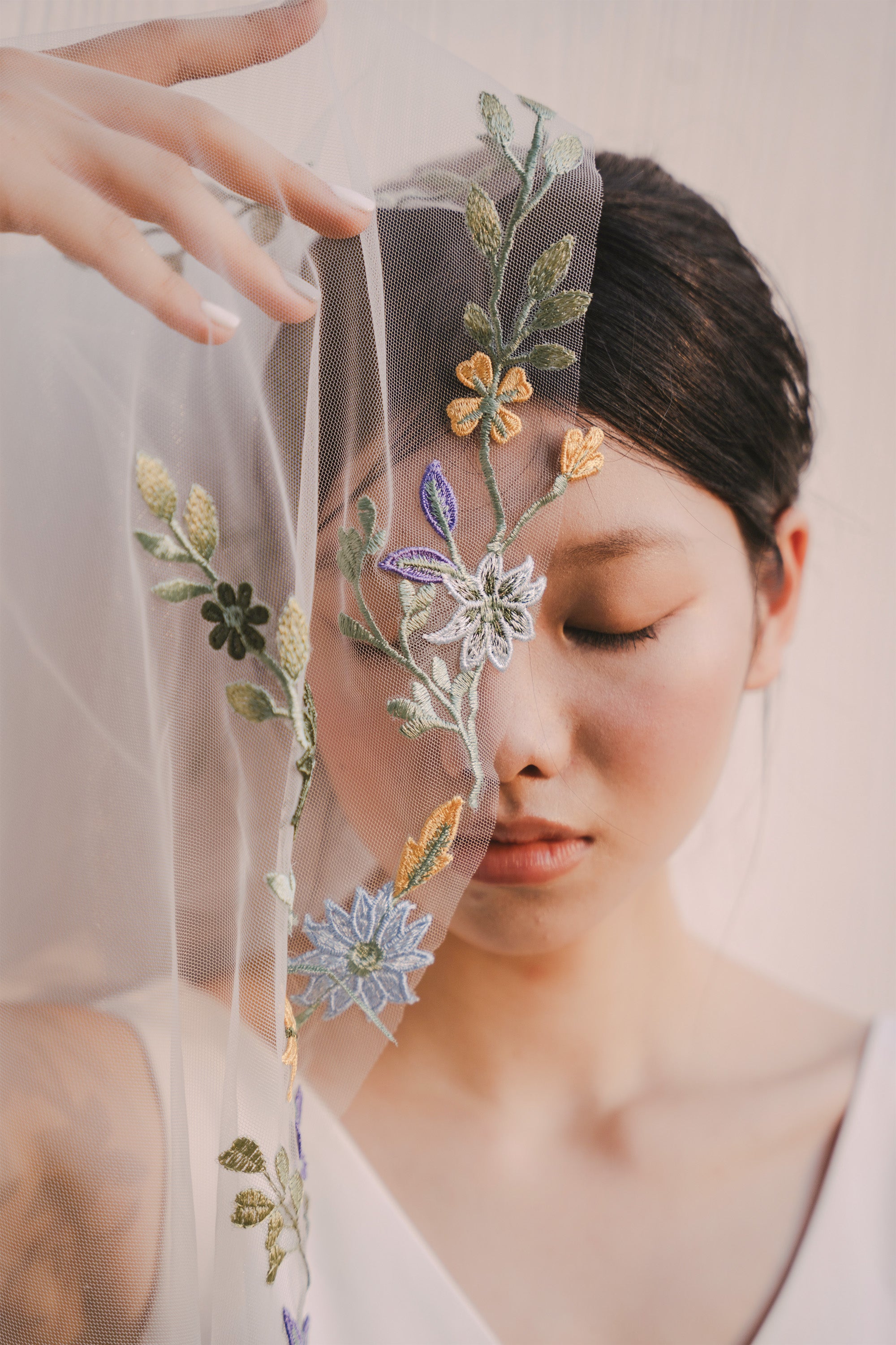 close up shot of PAOLA | Colorful floral lace wedding veil