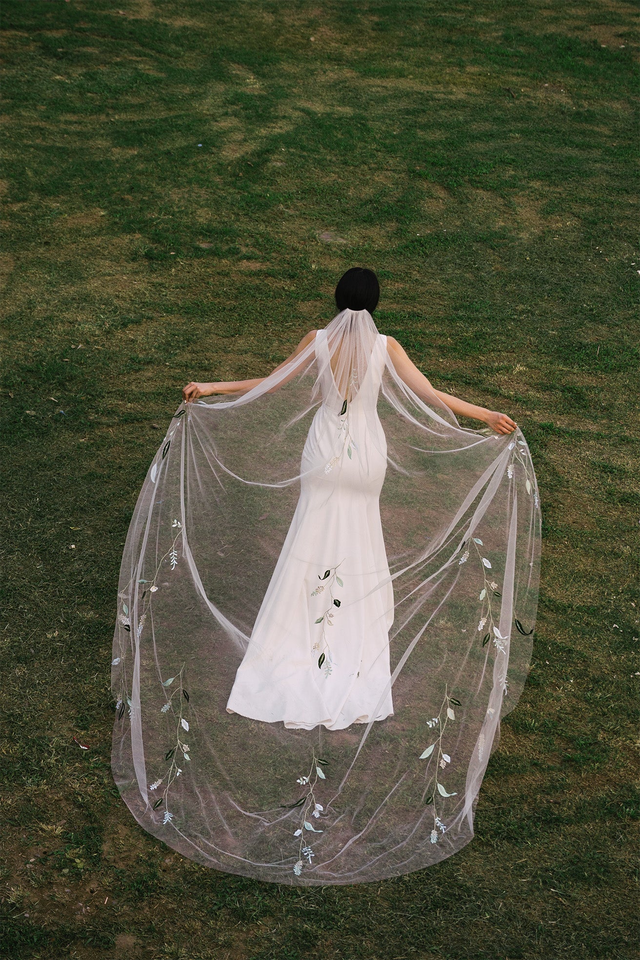 full shot from behind of NILSA | Green embroidery floral wedding veil