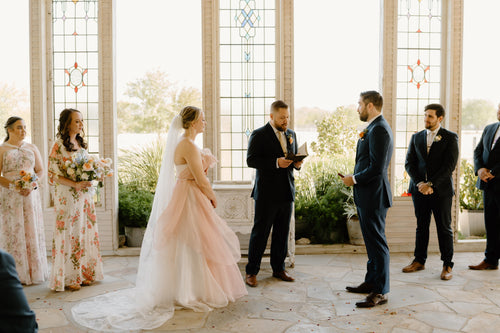 Kait Galligan bride wearing a chapel floral wedding veil and a dreamy pinky wedding dress