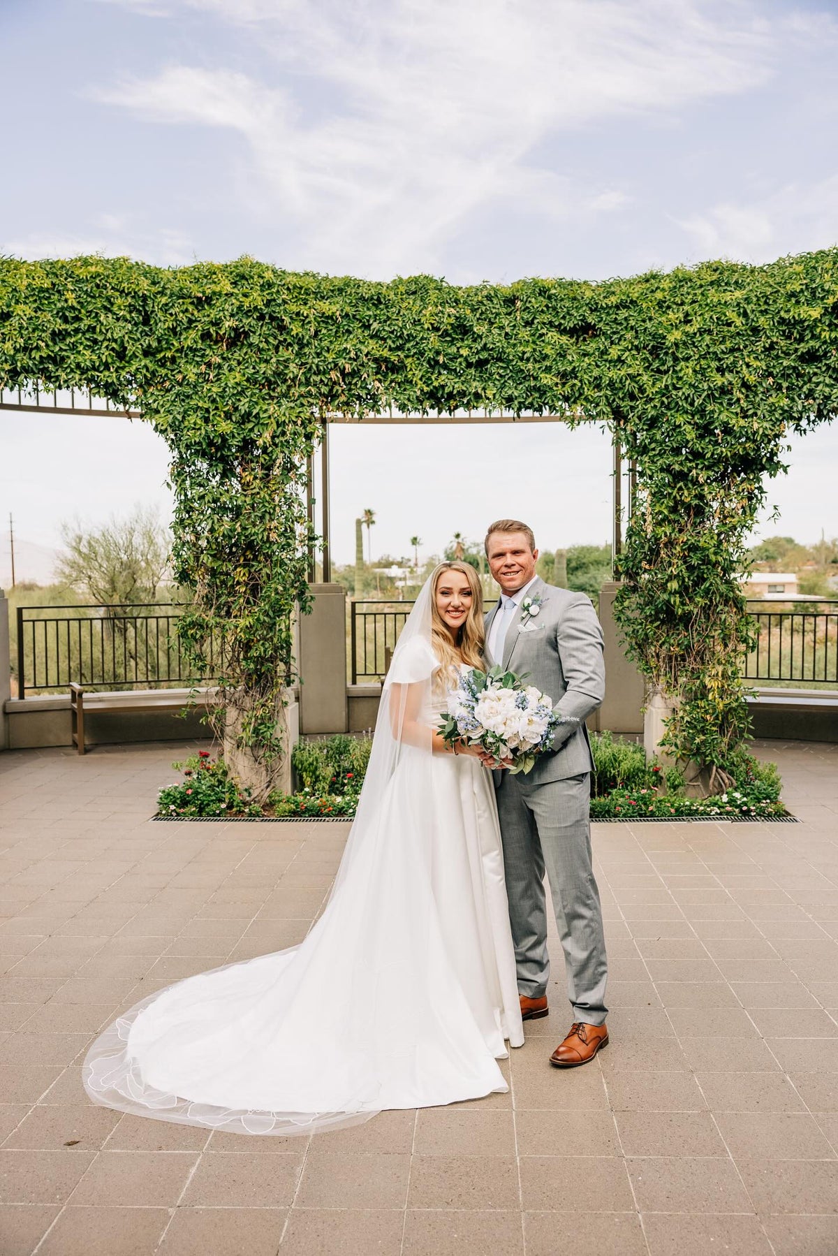 Bride Kiera Jarvis wearing Kaitie floral veil chapel-length