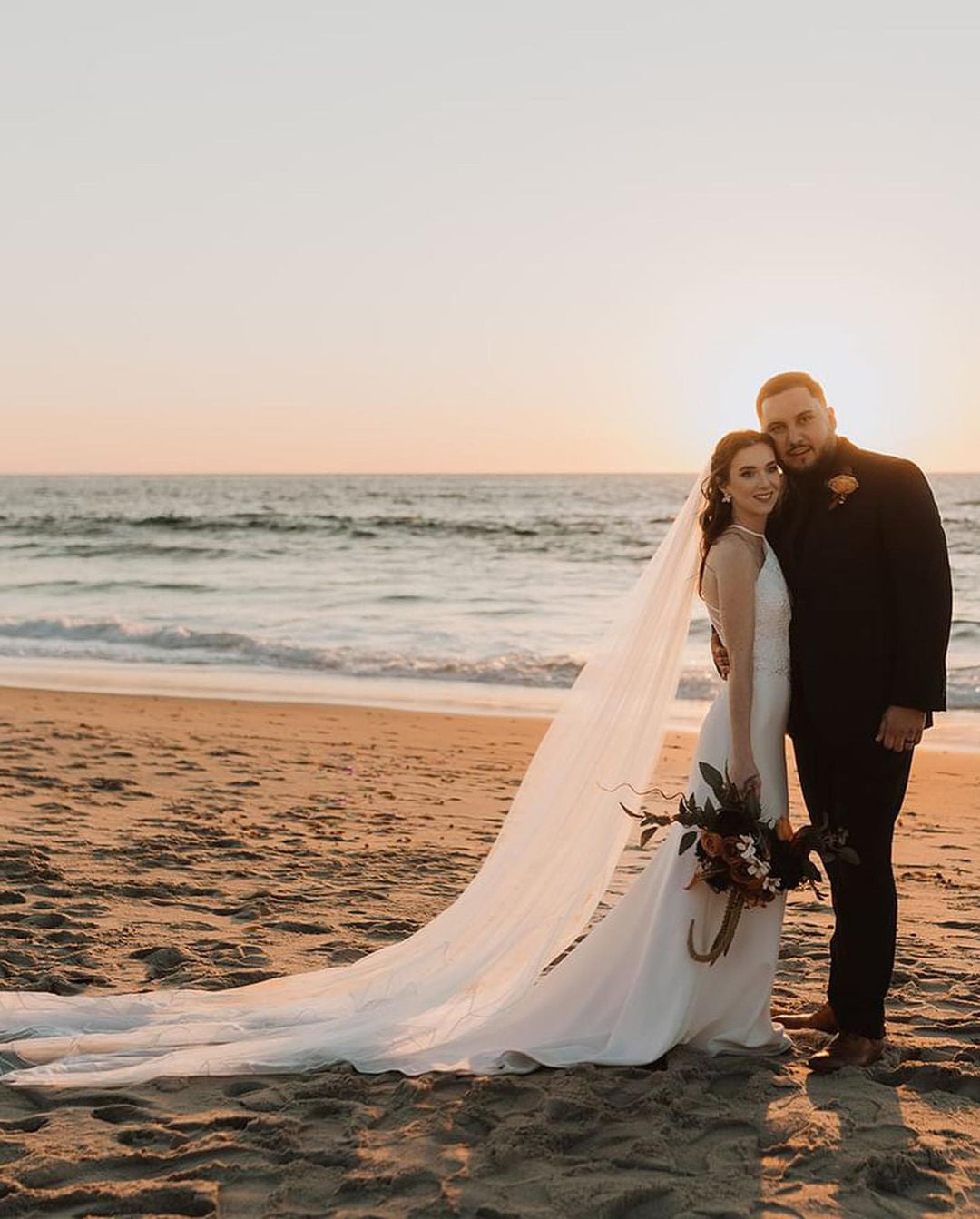 Bride wearing Kaitie cathedral embroidery floral veil front view