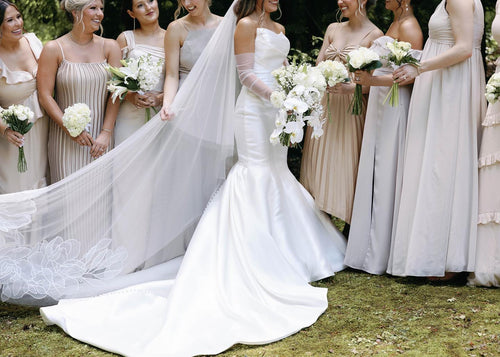 Bride Haley Bethel wearing floral cathedral wedding veil featuring white bouquet