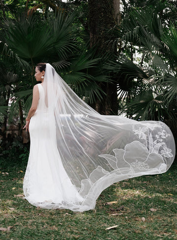 bride wearing floral organza veil featuring lilly gradiolous columbine sweet pea violets anenome flowers